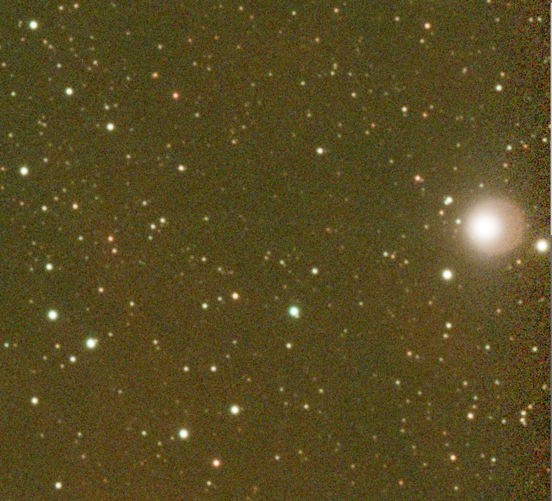 Star field with a bright star near the right edge, surrounded by a reddish halo